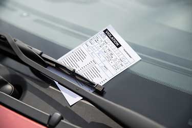 parking ticket on window of a car