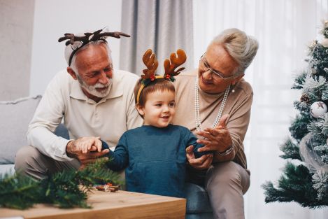 grandparents with grandkid at Christmas