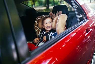 young toddler in a car seat