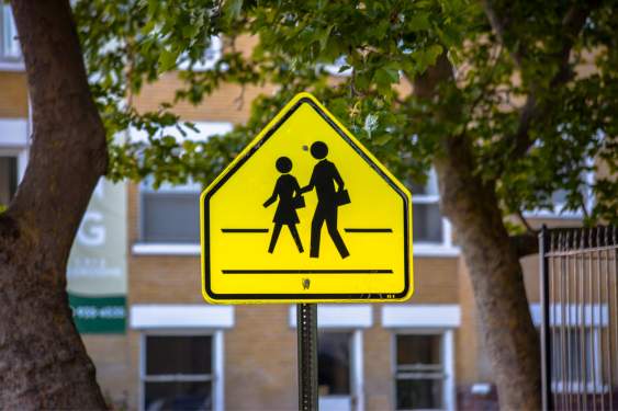 yellow school crossing sign