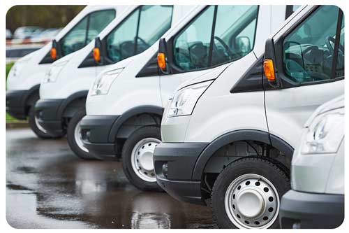 commercial delivery vans parked in row