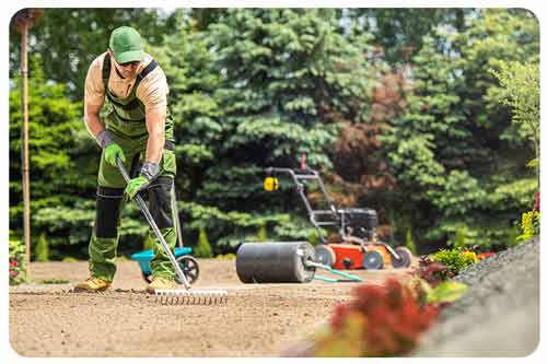 gardener, raking soil, lawn care equipment.