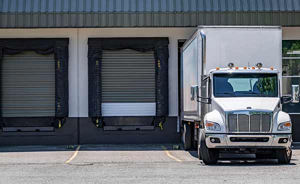 semi trailer loading commercial cargo at a warehouse