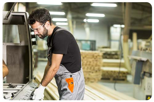 man working in a wood working factory
