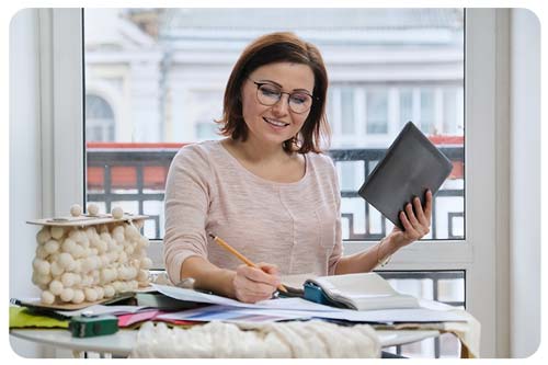 Woman working from home business doing paperwork