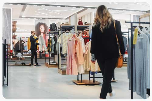 retail fashion shop assistant helps clients