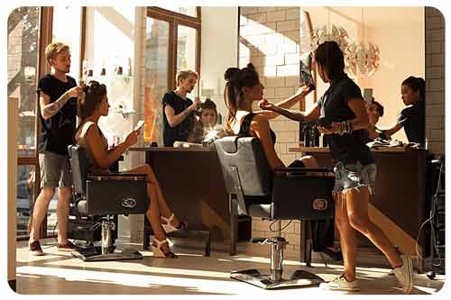 hairdresser makes hair styling in a salon