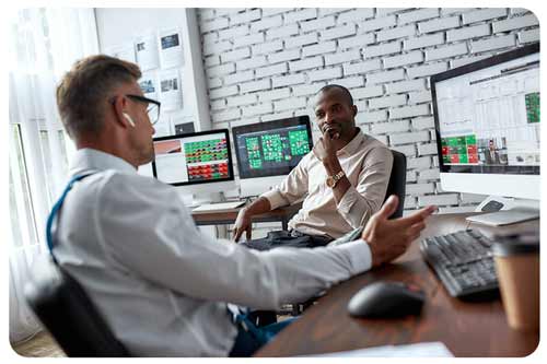 two colleagues traders talking to each other