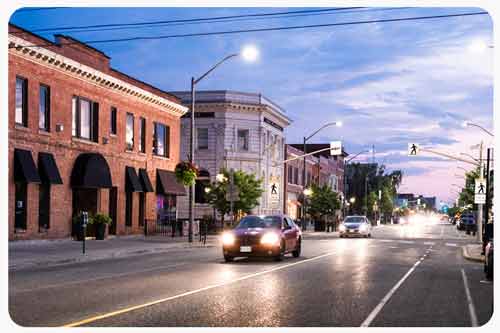 Cars driving on road in Windsor city street