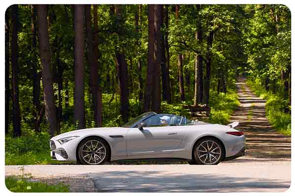gray sports car on a country road