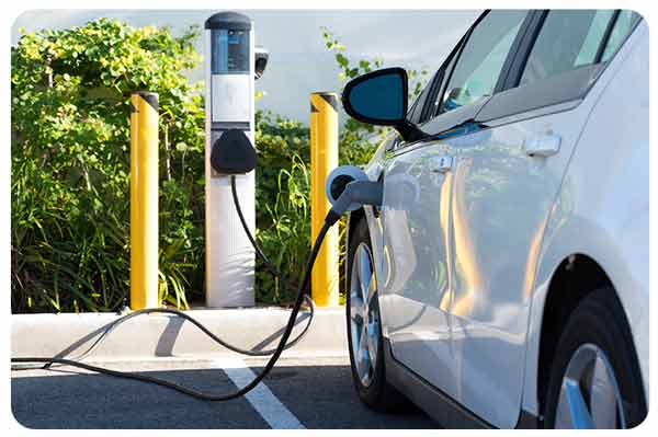 White car parked at charging station