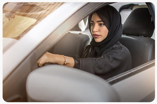 an woman driving a car