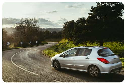 a car riding on road
