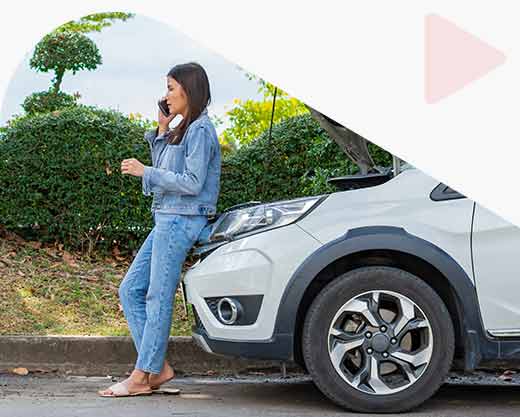 a woman and using mobile phone calling for assistance