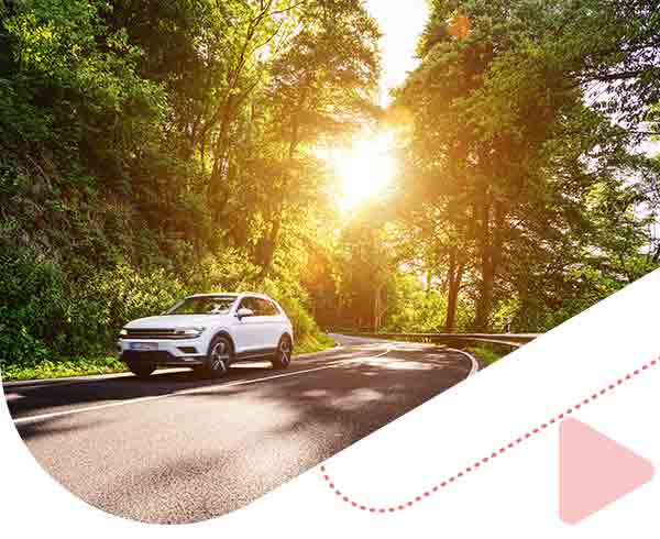white SUV driving on road