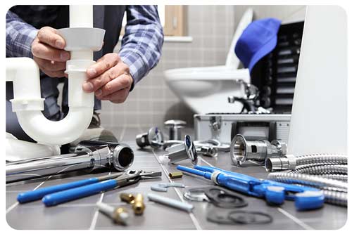 a plumber repairs, assembles and installs bathroom fixtures.