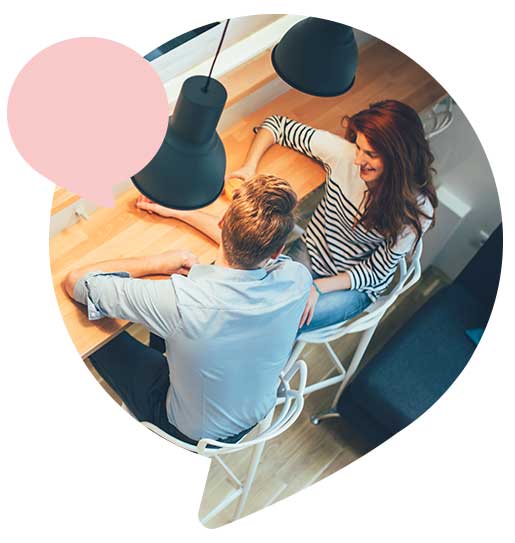 couple sitting at kitchen counter