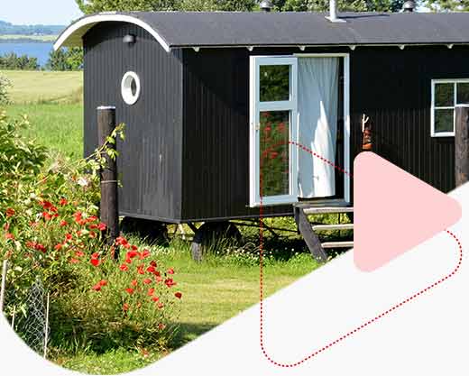 black tiny home in the country 