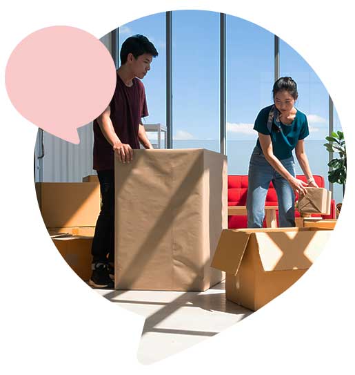 Young couple moving into an apartment unpacking boxes