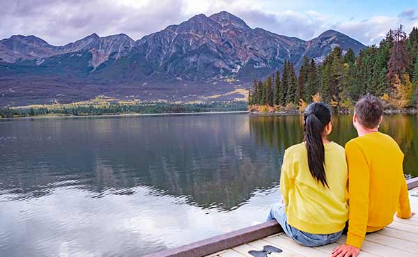 couple looking away enjoying day in Jasper National Park Alberta
