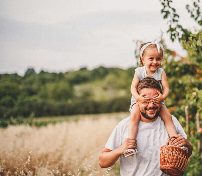 family walking down the road outside in nature