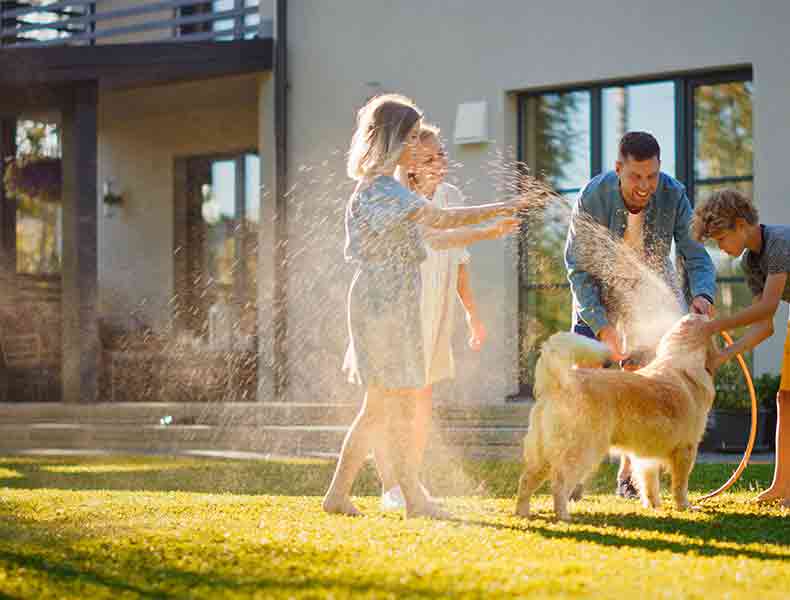 family having fun time together in backyard.