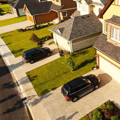 Car parked in driveways in neighborhood 