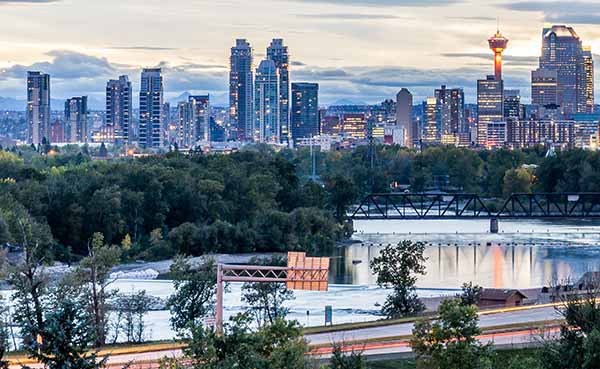 Calgary downtown in the evening at sunset with Bow River