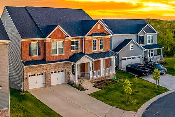 Two cars are parked in the driveway
