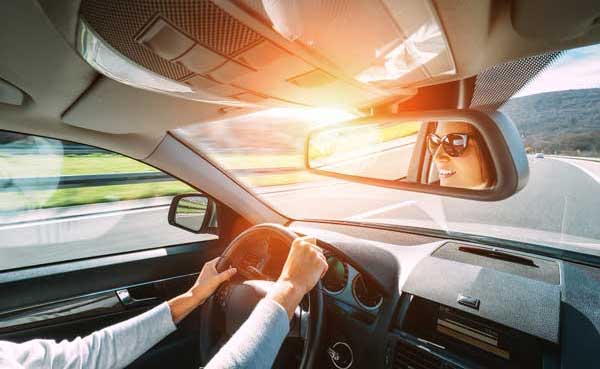 woman driving a car on highway
