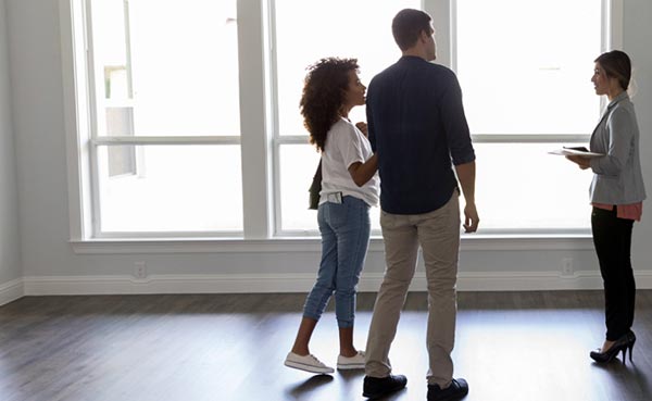 real estate agent showing home