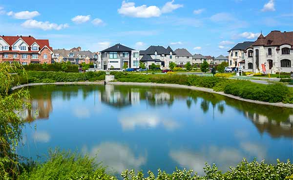 Small pond in the neighborhood with the houses 