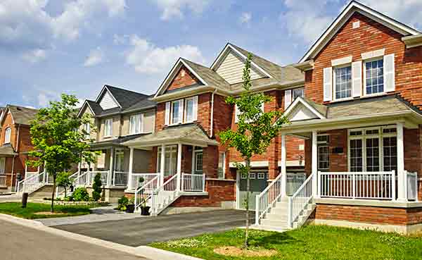residential street with row of red brick townhouses