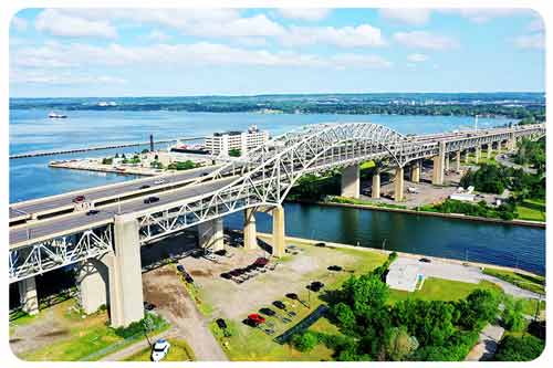 man stand at new house and car
