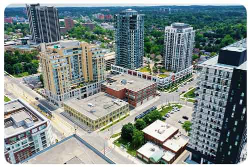 a female driver with glasses looks out of the car