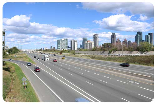 female driver checking rear view mirror looking backwards