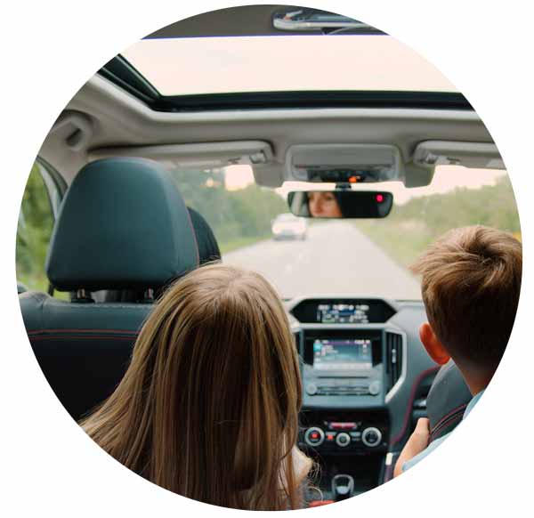 happy family is driving a car