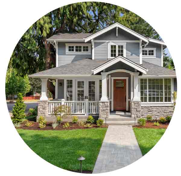 house with covered porch and green grass