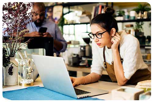 business owner checking her laptop