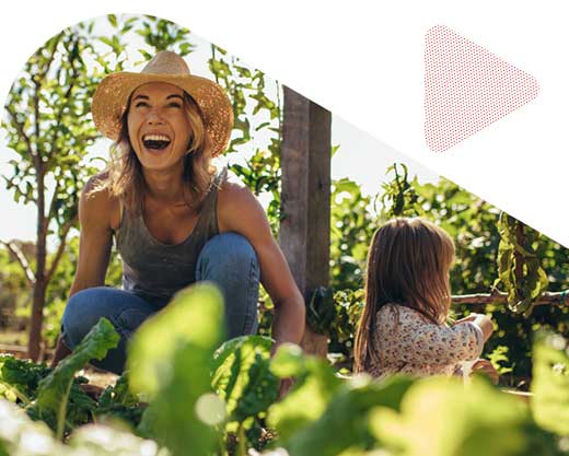 Young mother and daughter working in the farm