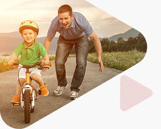 Happy father and son riding a bike