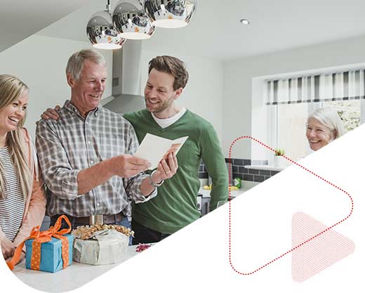 The two children giving their father a birthday card and gifts