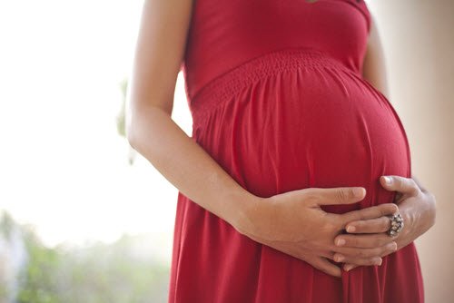 Pregnant woman in a red dress