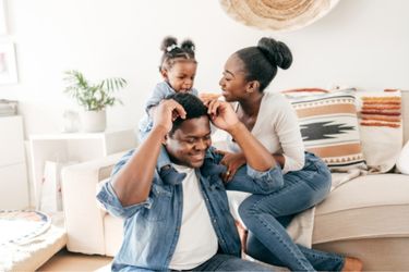 a black family enjoying family time together