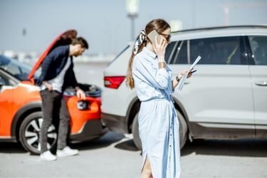 range and white vehicle in an accident