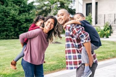 family outside smiling