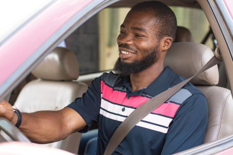 black man driving a vehicle