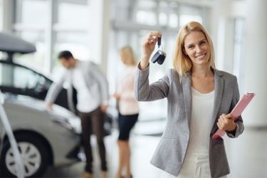 Couple at a used car lot