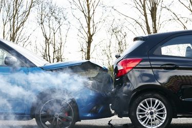 blue and black car damaged from rear end car accident