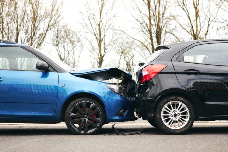 rearend car accident with blue and black car